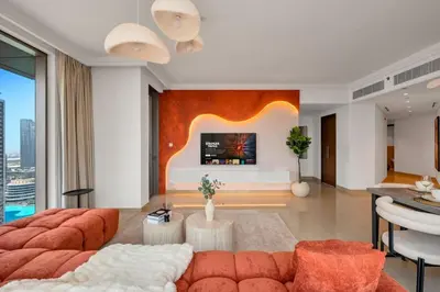 a living room with a couch and a table at Cosmic Address 2BR Burj Views above Dubai Mall - By Maxx Value Homes in Dubai
