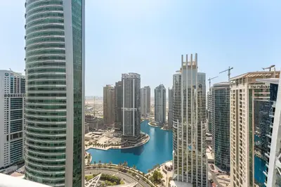 a view of a city with tall buildings and a river at Modern 1 Bed With Marina Views Near JBR Beach in Dubai