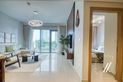 a living room with a bed and a couch at Luxury 1BR Harbour Views Tower 2 Creek Harbour Dubai in Dubai