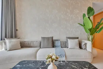 a living room with a couch and a table at Luxury-Brand New-Direct Access toThe Dubai Mall in Dubai