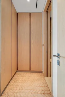 an empty room with wooden doors and a hallway at Luxury-Brand New-Direct Access toThe Dubai Mall in Dubai