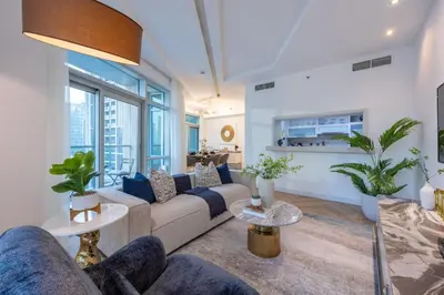 a living room with a couch and tables at The Lofts Downtown - Stunning Burj Khalifa View in Dubai
