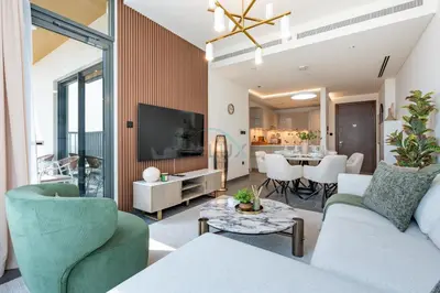 a living room with a couch and chairs and a table at High-Floor 2BR with Skyline Views, Steps from a Park, Minutes Drive to Meydan Golf Club and Ras Al Khor Wildlife Sanctuary, Sobha Hartland The Crest Tower C, Sobha Hartland by Deluxe Holiday Homes in Dubai