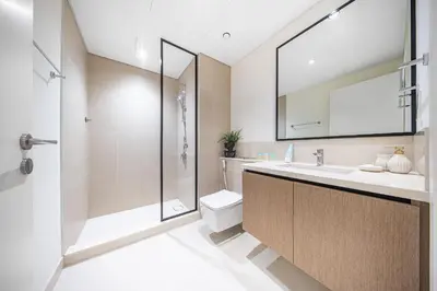 a bathroom with a toilet and a sink and a shower at DVH Luxe Retreats 2 Bedroom Downtown by Burj Khalifa and Dubai Mall in Dubai