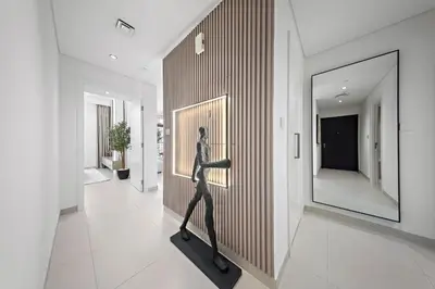 a statue of a woman on a wall in a hallway at DVH Luxe Retreats 2 Bedroom Downtown by Burj Khalifa and Dubai Mall in Dubai