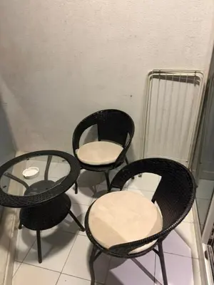 a group of four chairs sitting next to a radiator at Royal Montania by DAMAC Maison Prive in Dubai