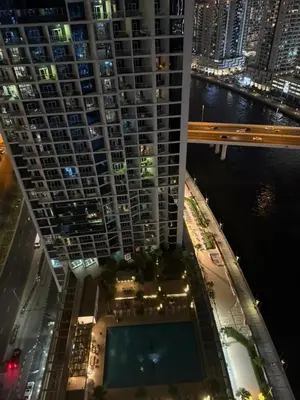 an overhead view of a large building with a pool at Royal Montania by DAMAC Maison Prive in Dubai