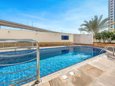 a swimming pool with blue water in a building at Luxury 5 Star Newly Furnished 3BR Apartment in Dubai Marina in Dubai