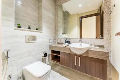 a bathroom with a sink and a toilet at Stunning 1BR with Panoramic Canal Views, Convenient Downtown Access and Walking Distance to Bus Stop, J One - 1, Business Bay by Deluxe Holiday Homes in Dubai