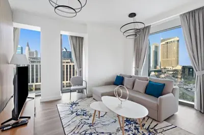 a living room with a couch and a table at FIRST CLASS 1BR Breathtaking Marina Views in Dubai