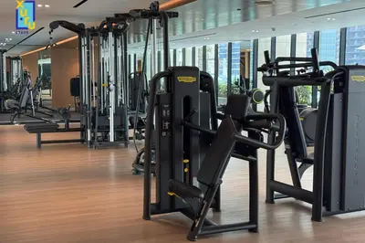 a gym with lots of treadmills and elliptical machines at Timeless & Textured Studio w Jacuzzi Trillionaire in Dubai