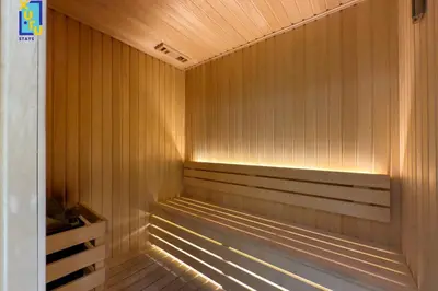 a sauna with wood paneling and a wooden floor at Timeless & Textured Studio w Jacuzzi Trillionaire in Dubai