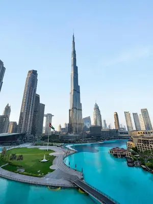 a view of a city with a river and skyscrapers at Panoramic Burj 5br Condo with Full Led & Fountain View in Dubai