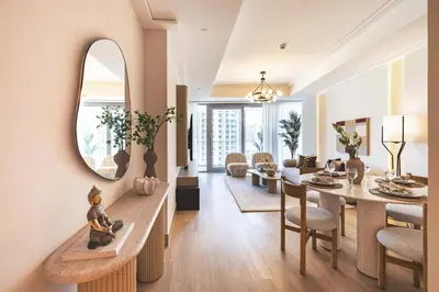 a living room with a dining table and a mirror at The Opera Grand Ultra Luxury Suite Burj Khalifa and Fountain View in Dubai