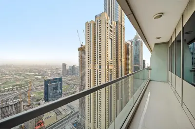a view of a city from a building balcony at Elegant 2BR with Panoramic Marina View in Dubai