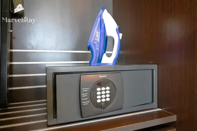 a small tv with a blue award on top of it at MarvelStay - Connected to Mall & Metro - JW Marriott in Dubai
