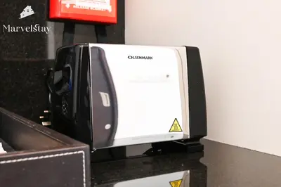 a computer printer sitting on top of a counter at MarvelStay - Connected to Mall & Metro - JW Marriott in Dubai