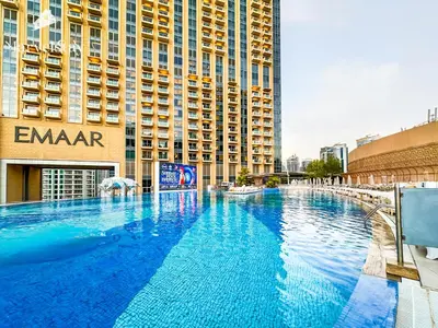 a large swimming pool in front of a building at MarvelStay - Connected to Mall & Metro - JW Marriott in Dubai