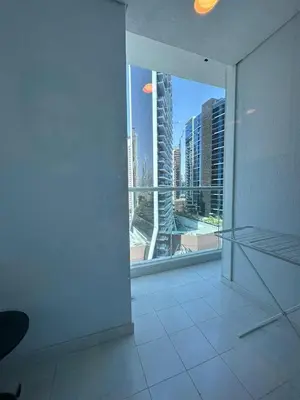 an empty room with a view of a city at Damac Maison Prive in Dubai