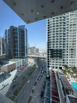 a view of a street in a city with buildings at Damac Maison Prive in Dubai
