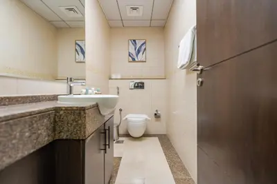 a bathroom with a sink and a toilet at Bright 1bhk Full Marina View in Dubai