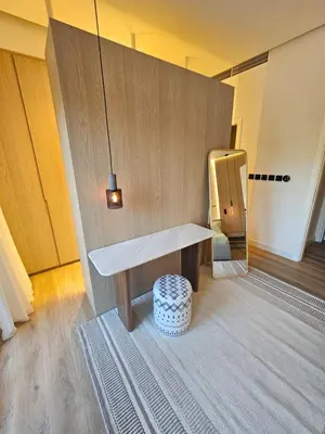 a room with a bench and a stool at Architect Designed house 2 BR with Private Pool in Dubai