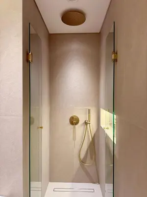 a bathroom with a shower with a glass door at Architect Designed house 2 BR with Private Pool in Dubai