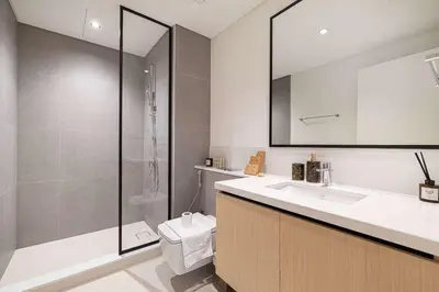 a bathroom with a toilet and a sink and a shower at Luxury 4BR Burj Khalifa Dubai Mall in Dubai
