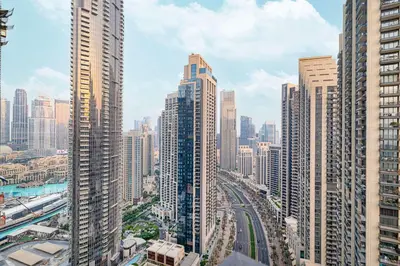 a view of a large city with tall buildings at Luxury 4BR Burj Khalifa Dubai Mall in Dubai