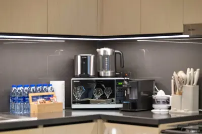 a kitchen with a coffee maker on a counter at Luxury 4BR Burj Khalifa Dubai Mall in Dubai