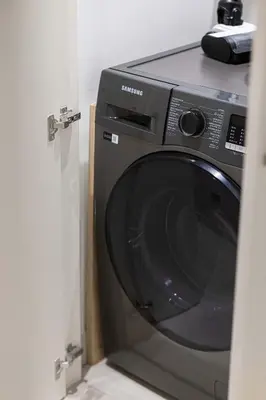 a washing machine sitting in a room at Luxury 4BR Burj Khalifa Dubai Mall in Dubai