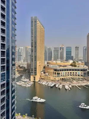 a view of a city with boats in the water at New Modern Marina View Apartment in Bay Central in Dubai