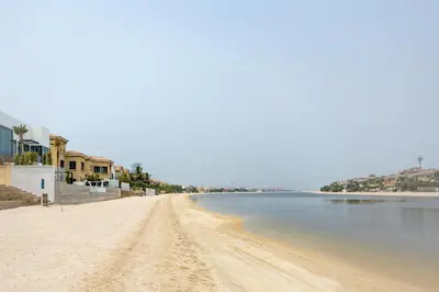 a view of a beach with houses on it at Palm Villa F, Palm Jumeirah - Mint Stay in Dubai