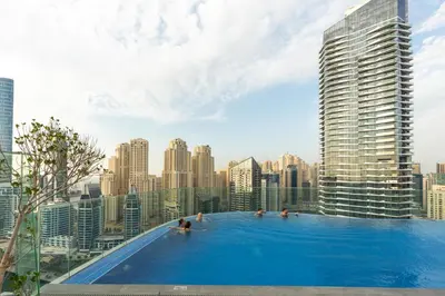 a large swimming pool on top of a city skyline at BLVD - Direct Marina Walk - Eye of Dubai Fireworks - Iconic Marina Views with Rooftop Pool in Dubai