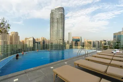 a large swimming pool on the roof of a building at BLVD - Direct Marina Walk - Eye of Dubai Fireworks - Iconic Marina Views with Rooftop Pool in Dubai