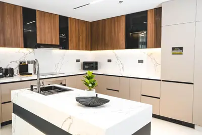 a kitchen with a white counter and a sink at Penthouse on 74th Floor 3 Bedrooms Palm Views in Dubai