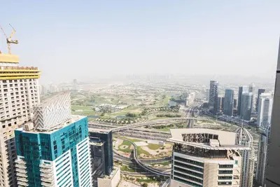 an aerial view of a city with tall buildings at Penthouse on 74th Floor 3 Bedrooms Palm Views in Dubai