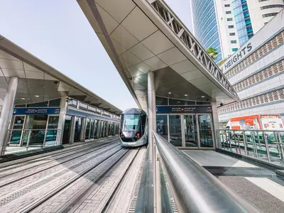 a train is pulling into a train station at Penthouse on 74th Floor 3 Bedrooms Palm Views in Dubai