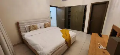 a bedroom with a large bed in a room at Lofts West Tower - Downtown by Golden Casa in Dubai