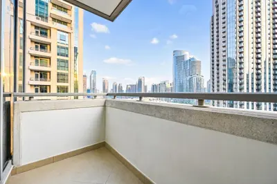 a balcony with a view of the city at Lux 1BR & Steps to Dubai Mall & Burj Khalifa in Dubai