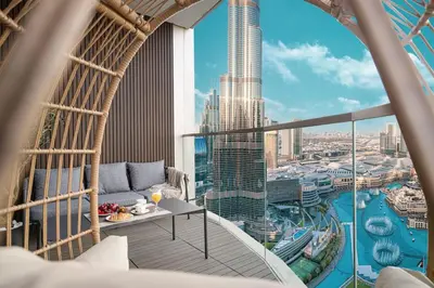 a balcony with a view of a city at Luxury 4BR Burj View Steps from Dubai Mall in Dubai