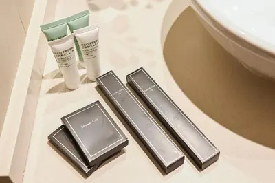 a bathroom with two products on a counter next to a sink at Dubai Marina Living 1BR near JBR in Dubai