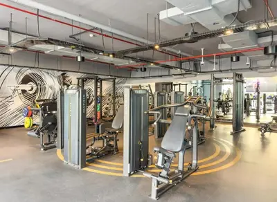 a gym with lots of treadmills and machines at Dubai Marina Living 1BR near JBR in Dubai
