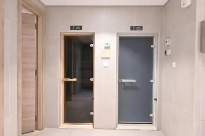 a hallway with two elevators in a building at Dubai Marina Living 1BR near JBR in Dubai