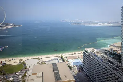 an aerial view of a beach and the ocean at Amazing 2 bedroom with Sea view ! Rimal ! in Dubai