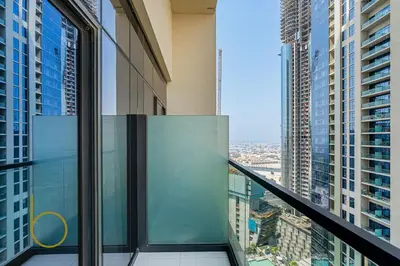 a balcony in a skyscraper with a view of a city at Bookable 2 bed Damac Aykon City with Balcony & Pool access in Dubai