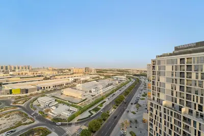 an aerial view of a city with a highway at FIRST CLASS Studio Cozy Comfort in Dubai