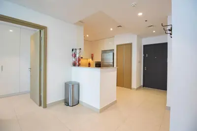 a kitchen with white walls and a counter top at Downtown Views 2BR-Direct Dubai Mall Connection in Dubai