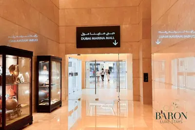 a mall with a glass door in a building at The sleek in Dubai