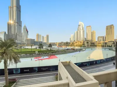 a view of a city skyline with a large pool at FIRST CLASS 2BR Luxury Facing Burj Khalifa in Dubai
